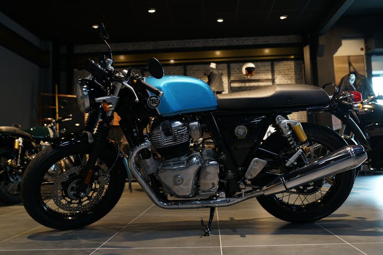 A Black And Blue Motorcycle Parked Inside The Store