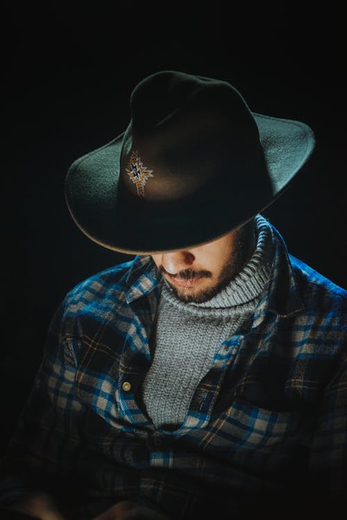 Free Man Wearing Cowboy Hat and Checkered Shirt  Stock Photo