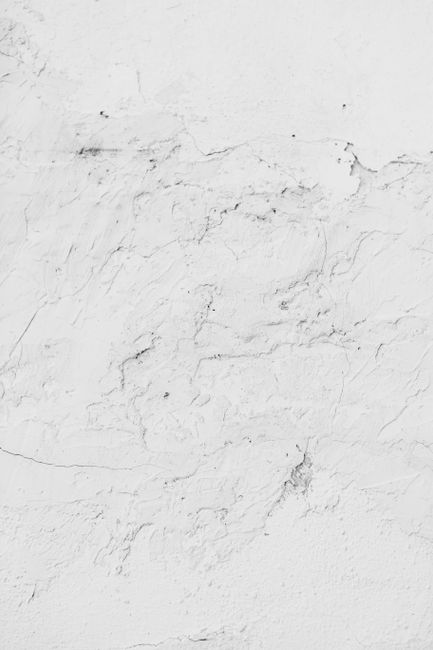 Sleek white marble surface with intricate textures, ideal for modern design projects.