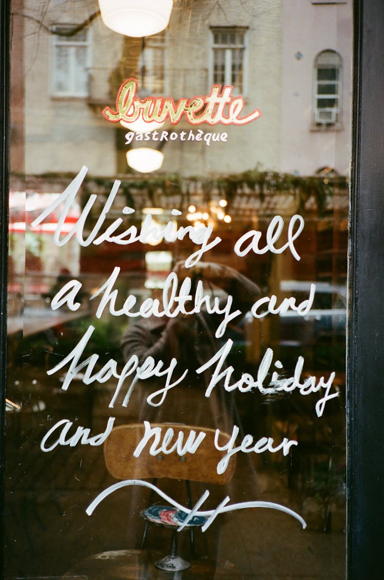 Holiday Wishes Written On Restaurant Window 