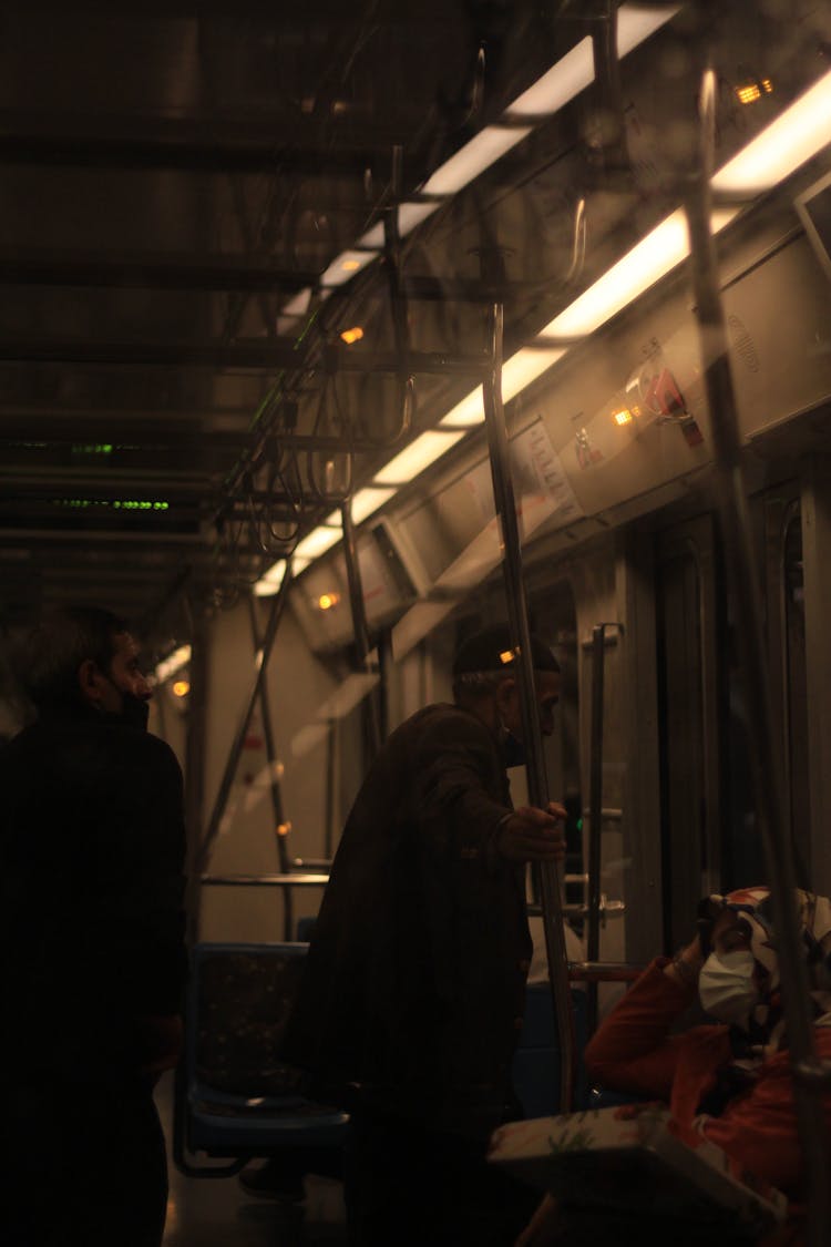 People Wearing Face Mask Riding On A Train