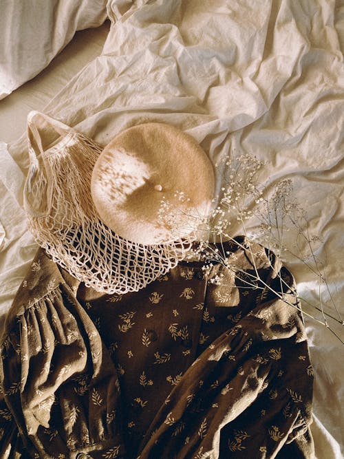 Dress, Beret and Eco Bag Lying on Bed