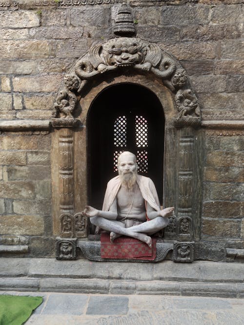Photo of a Meditating Man 