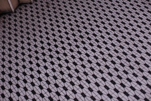 A detailed view of a vintage geometric mosaic tile floor with a retro pattern.. pexels, detailed, view