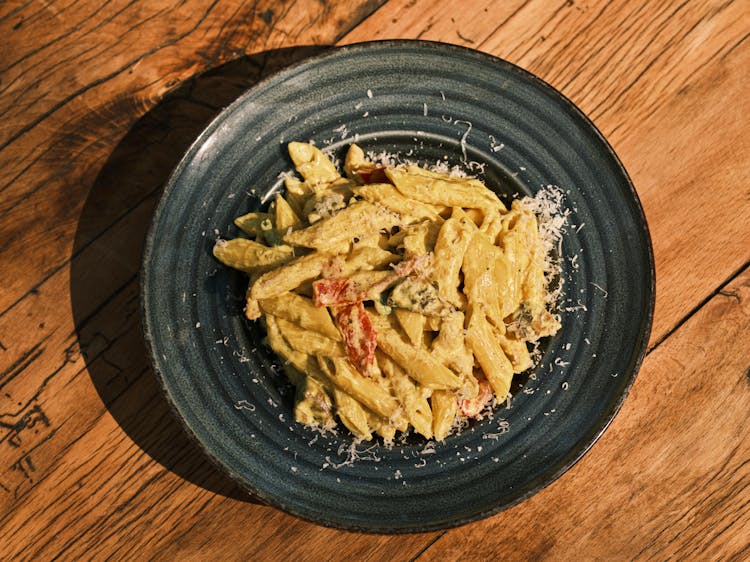 Cooked Penne Pasta On Black Plate