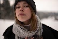 Woman in Black Knit Cap and Gray Scarf