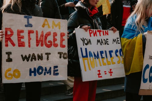 People Holding Placards