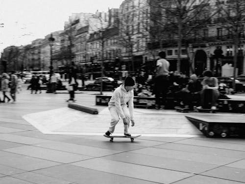 Man Skateboarding on the Sidewalk