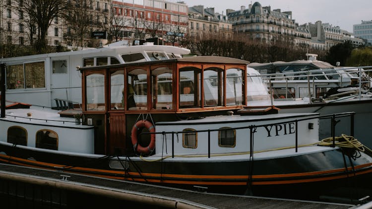 White And Brown Boat On Dock