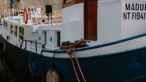 A Blue and White Boat on Dock