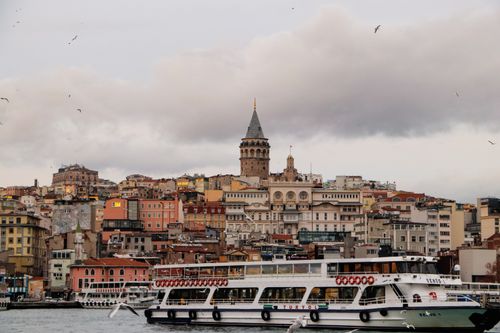 Free Captivating view of Istanbul with the iconic Galata Tower and ferry boats on the Bosphorus. Stock Photo