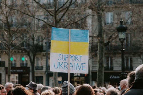 Large Group of People Holding Banner on Supporting Ukraine