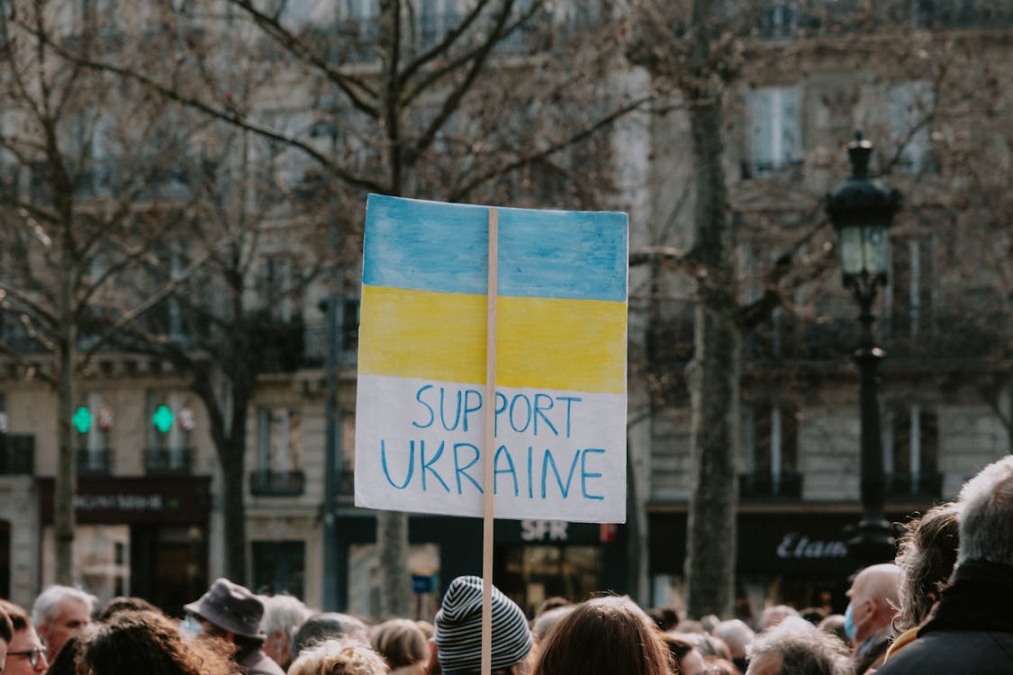 Large Group of People Holding Banner on Supporting Ukraine 