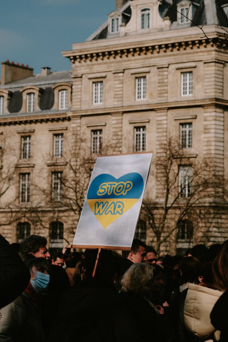 Anti War Inscription On Banner Hold By Group Of People