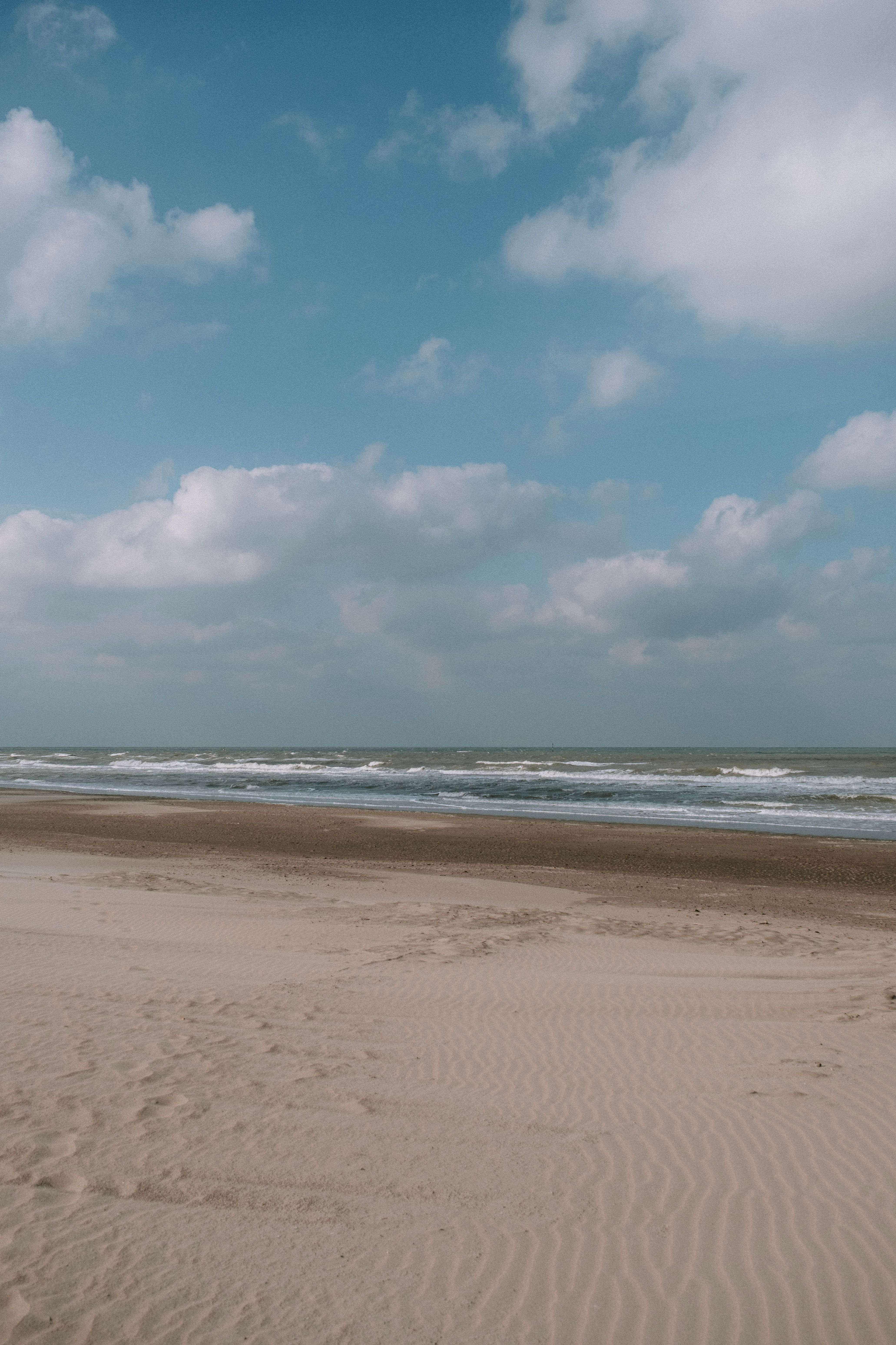 Beach Under Blue Sky and White Clouds · Free Stock Photo