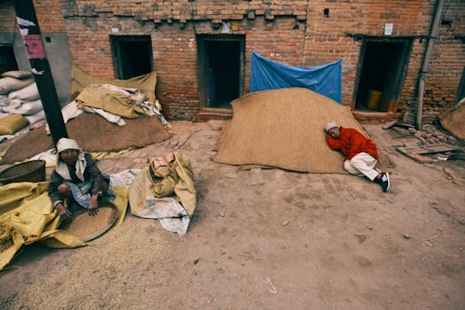 An urban scene depicting daily life and poverty in an alleyway with locals.