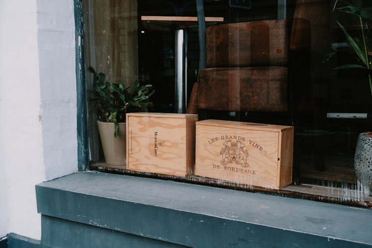 Wooden Wine Boxes Behind Window Glass