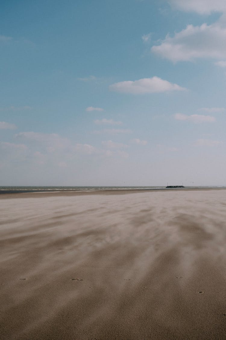 Flat Beach Under Blue Sky 