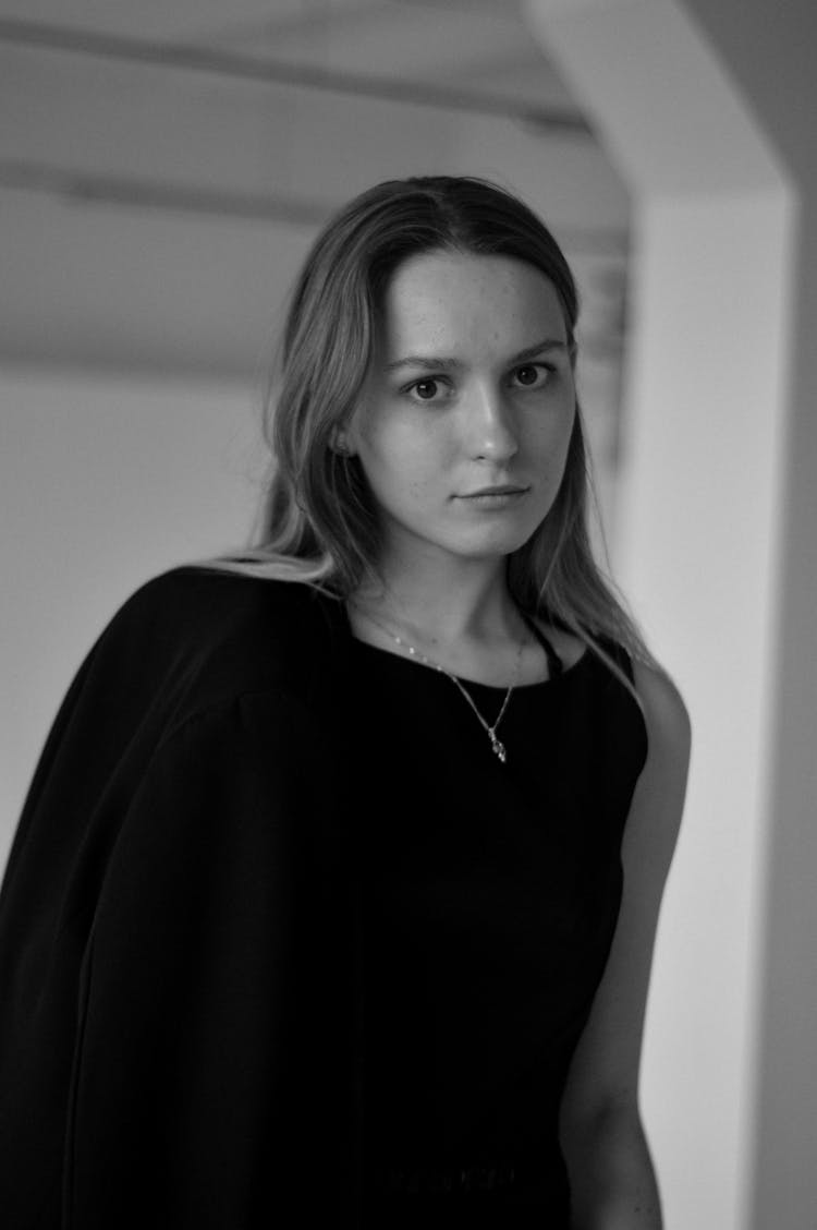 Teenage Girl With Long Fair Hair In Black Dress