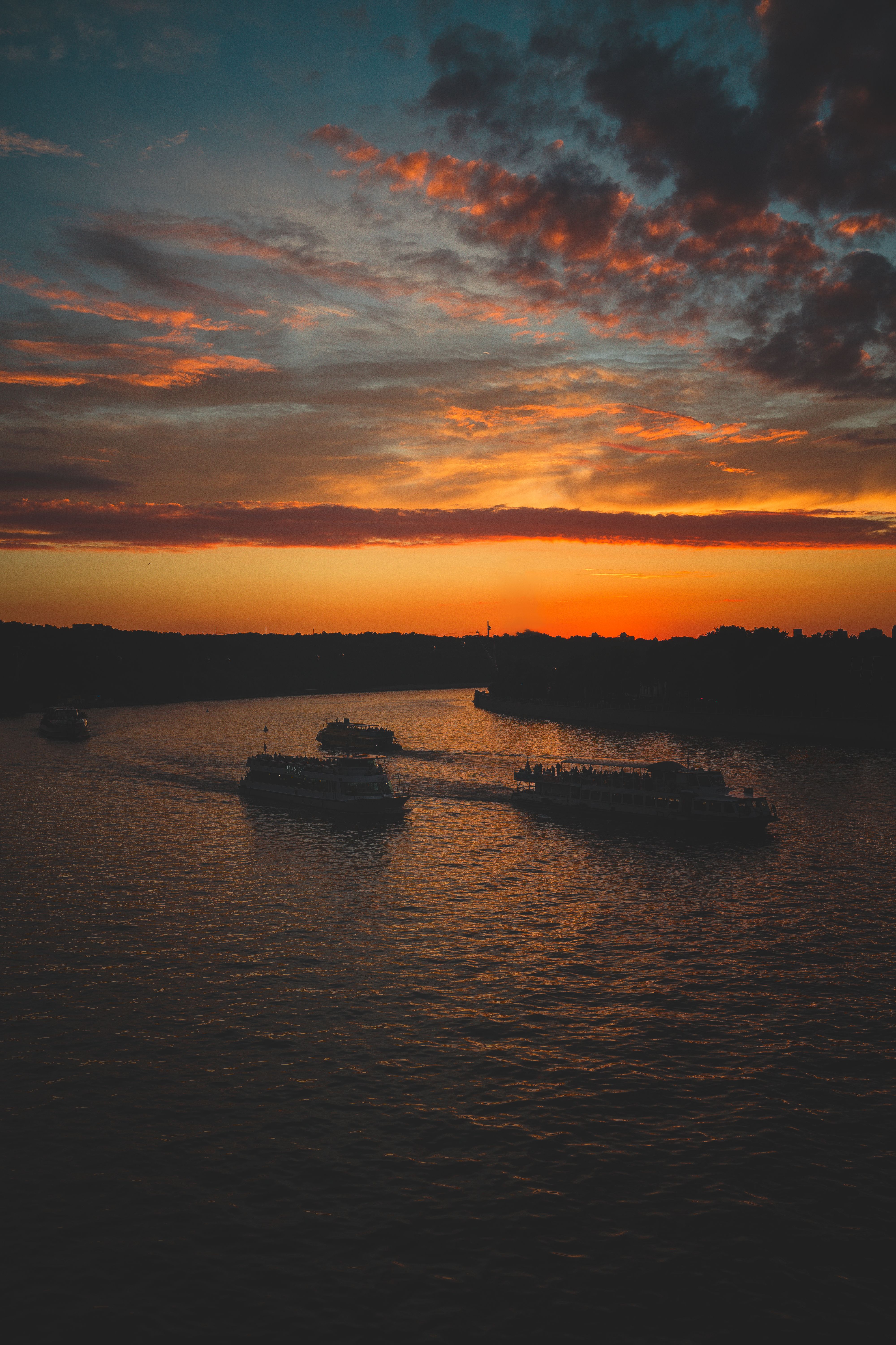 A Silhouette of Boat on Sea during Sunset · Free Stock Photo
