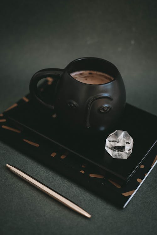 Free Black Ceramic Mug on Black Wooden Table Stock Photo