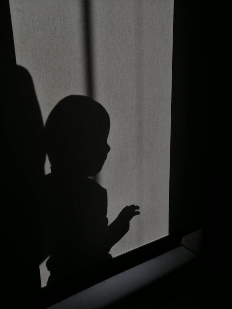 Child Shadow On Wall