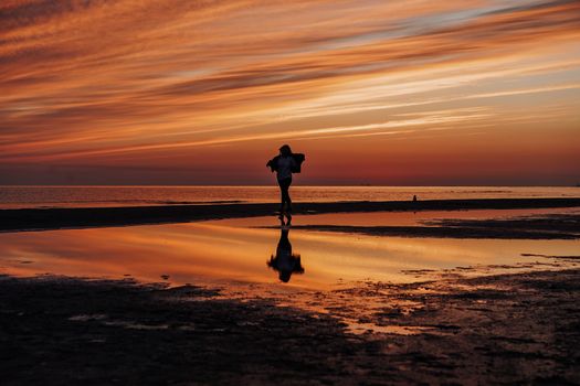 A Silhouette of a Person in early sunrise sky