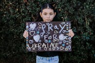Girl Holding a Chalkboard