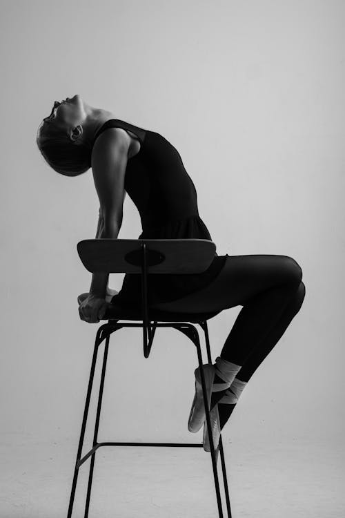 Free Ballerina Dancing on a Chair  Stock Photo