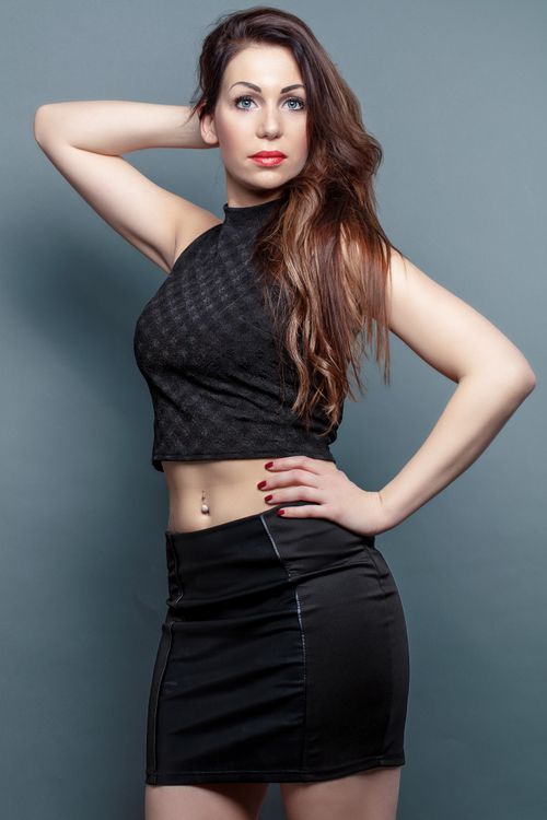 Free Elegant portrait of a young woman in fashionable attire posing confidently indoors. Stock Photo