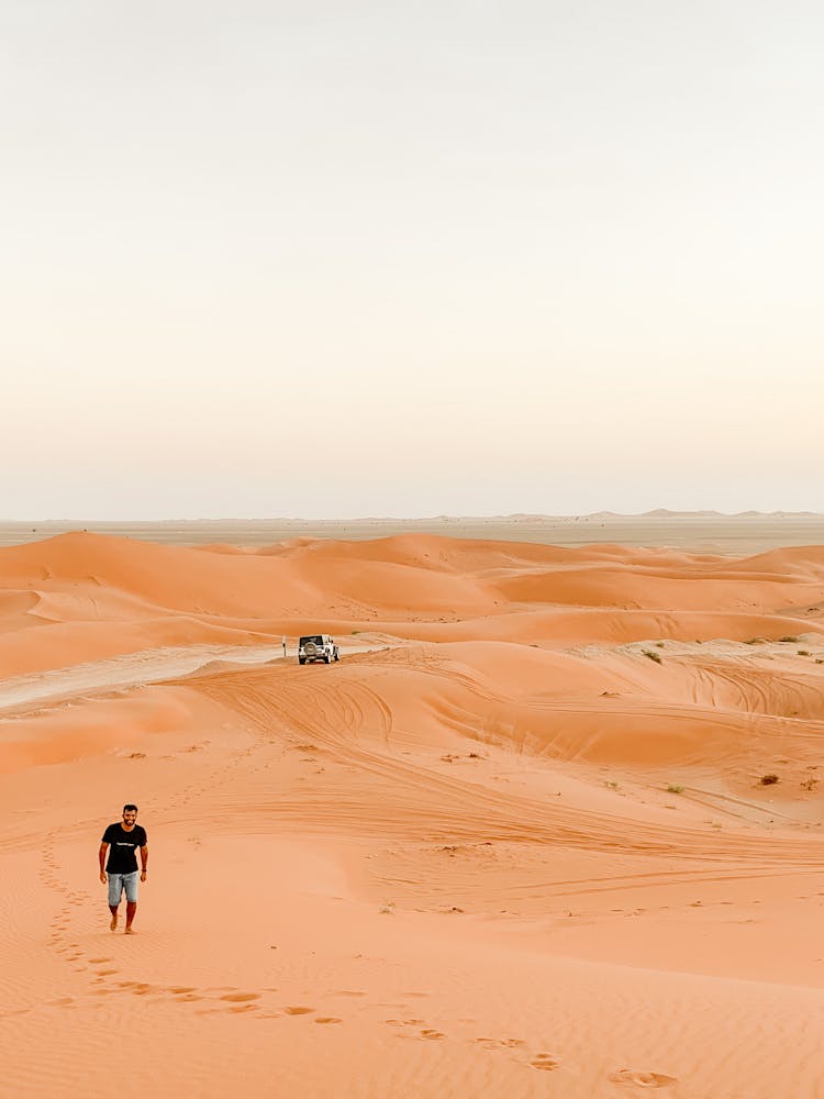 Man Walking On Desert