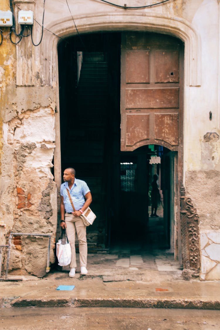 Man Standing At The Doorway