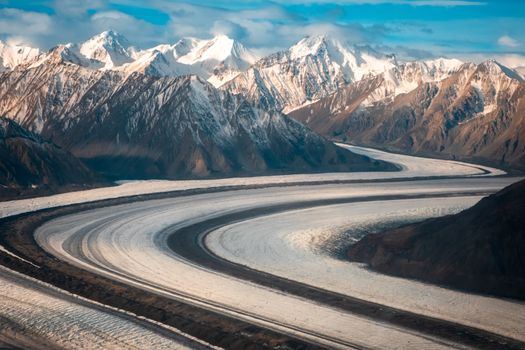 A breathtaking view of the snow-covered mountains and winding glacier in Haines Junction, Yukon Territory, Canada.
