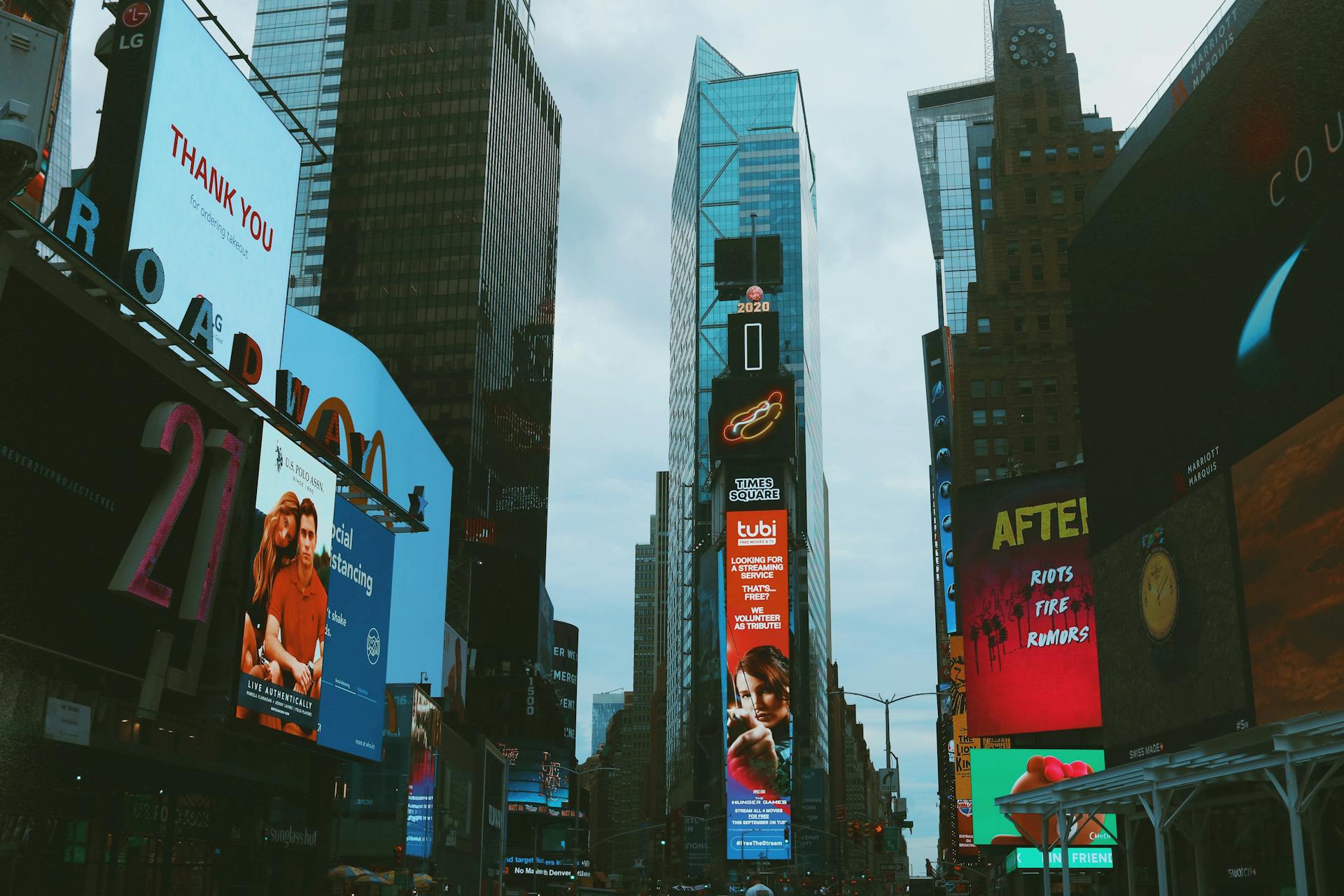 Bustling Times Square with bright billboards and towering skyscrapers in New York City.