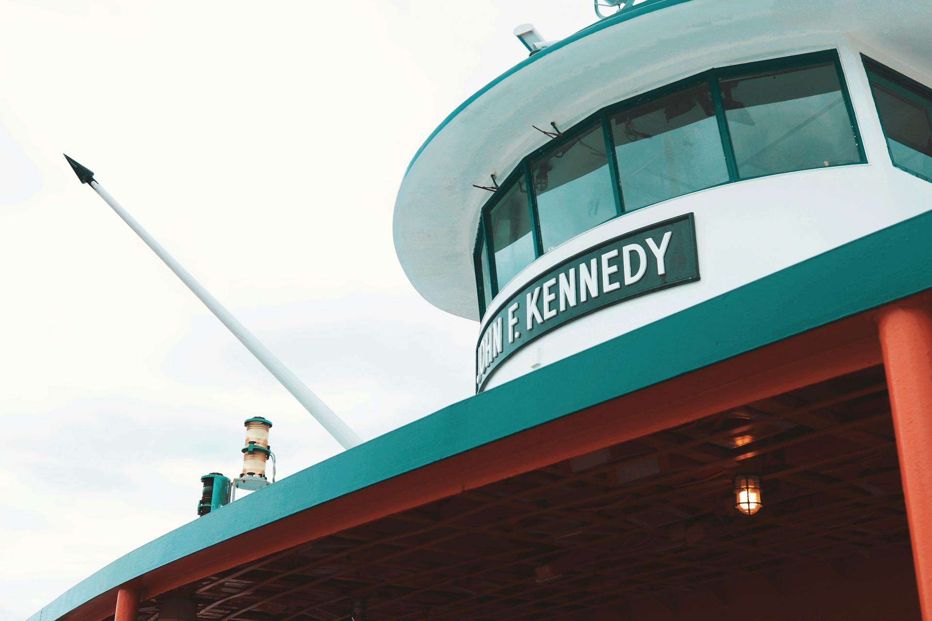 Low angle view of John F. Kennedy ferry exterior on a cloudy day, New York City.