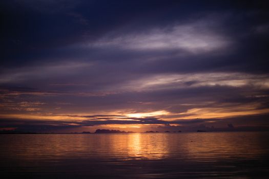 A breathtaking ocean sunset with vibrant colors reflecting on calm waters.