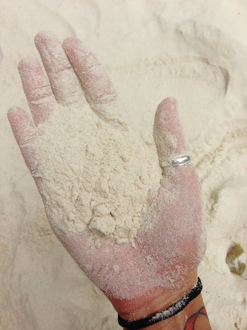 Sand on a Person's Hand