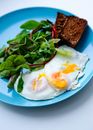 Eggs, Greens and Toast on Blue Plate