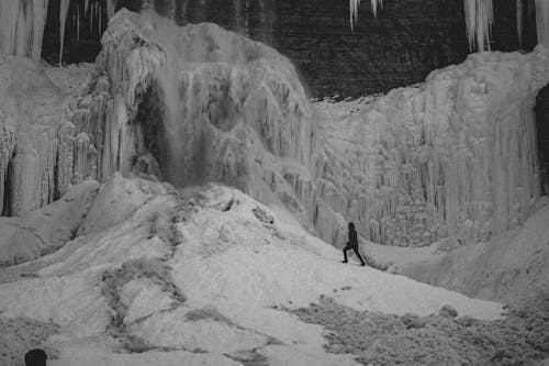 Man in Front of a Frozen Waterfall 