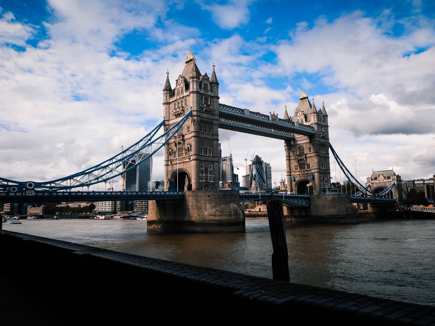 Beautiful shot of Tower Bridge in London over the River Thames with a cloudy sky.