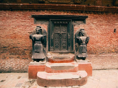 Statues near Door to Temple