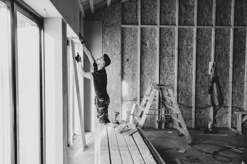 Man Doing Construction Work Inside House