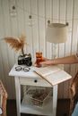 Unrecognized Female Hand Holding Glass of Drink on Bedside Table