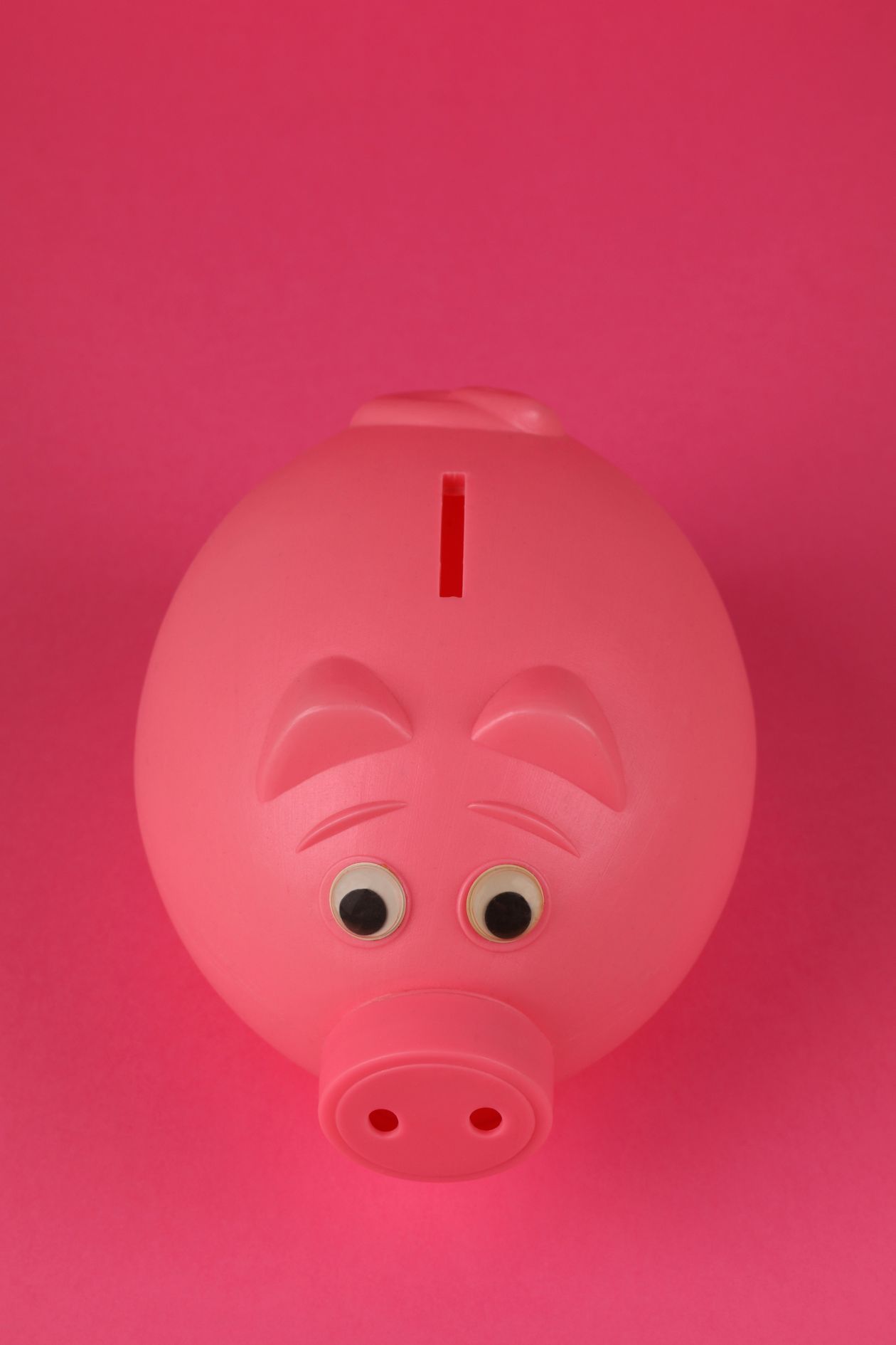 Pink piggy bank on a vibrant pink background representing a giveaway with donated prizes and no prize cost