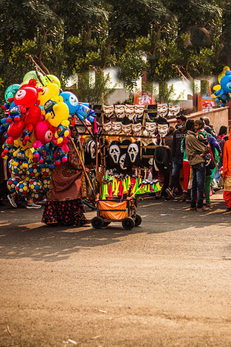 Woman Selling Masks And Toys