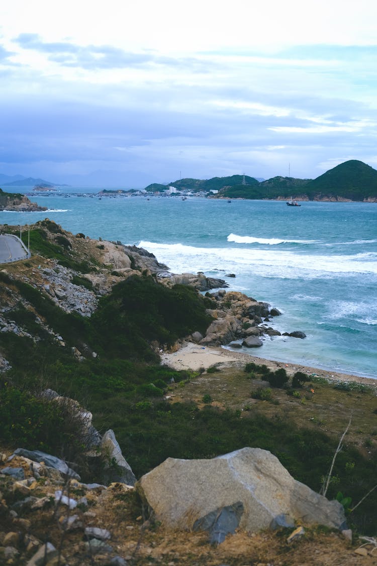 Cloudy Sky Over Rocky Coast