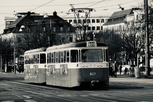 Grayscale Photo of a Tram on the Street