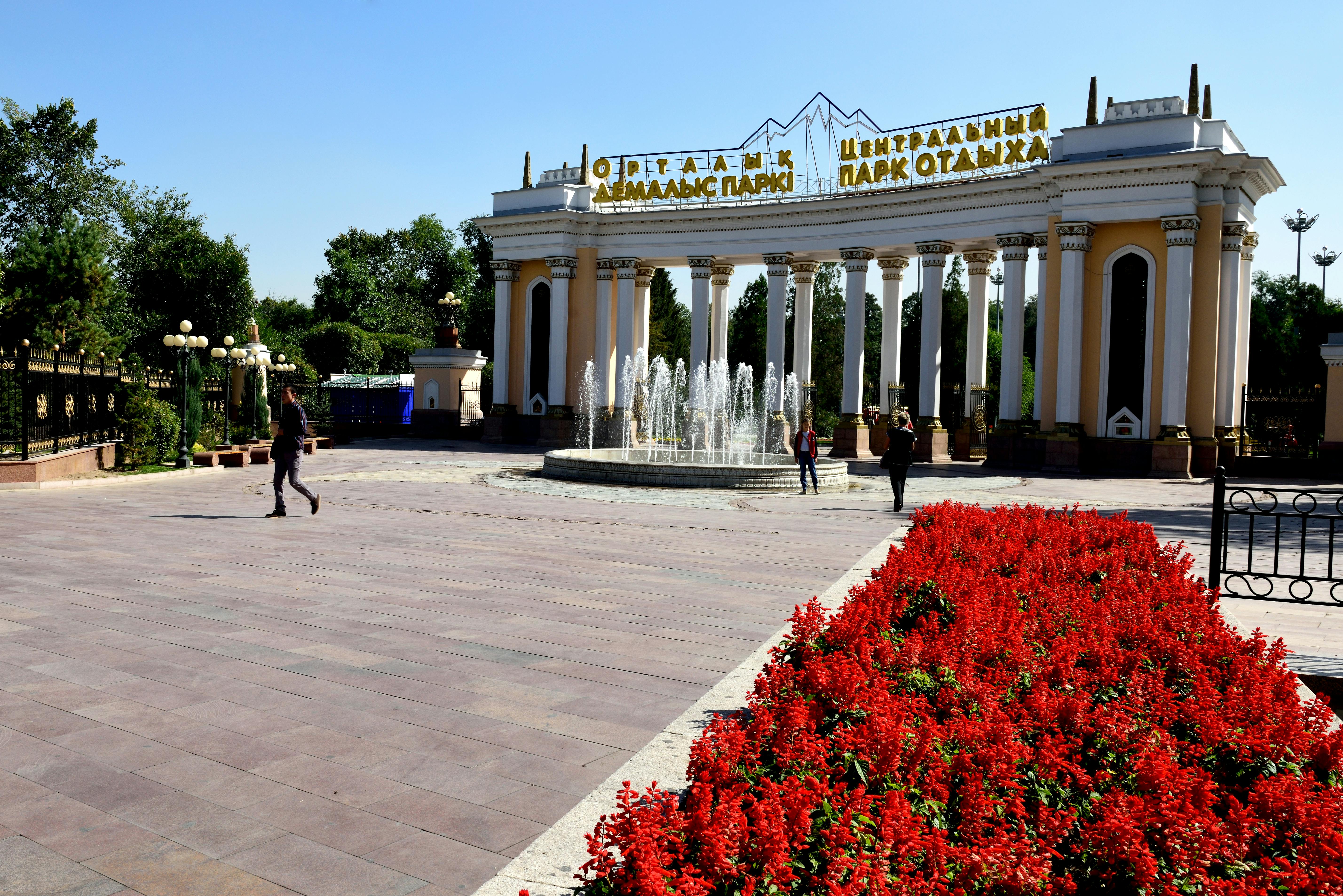 Football coach giving tactical instructions to a young player on the touchline
