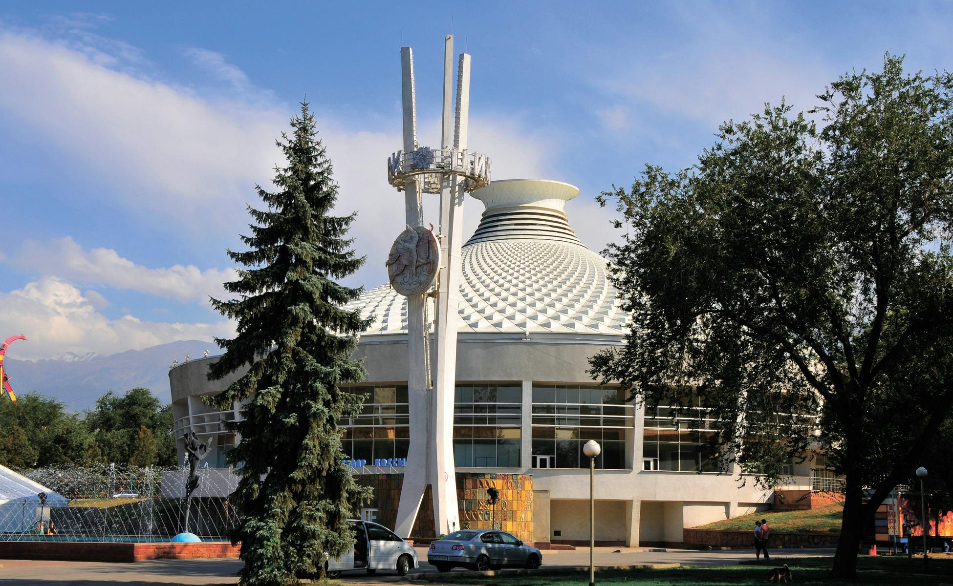 Football players celebrating a goal in front of fans