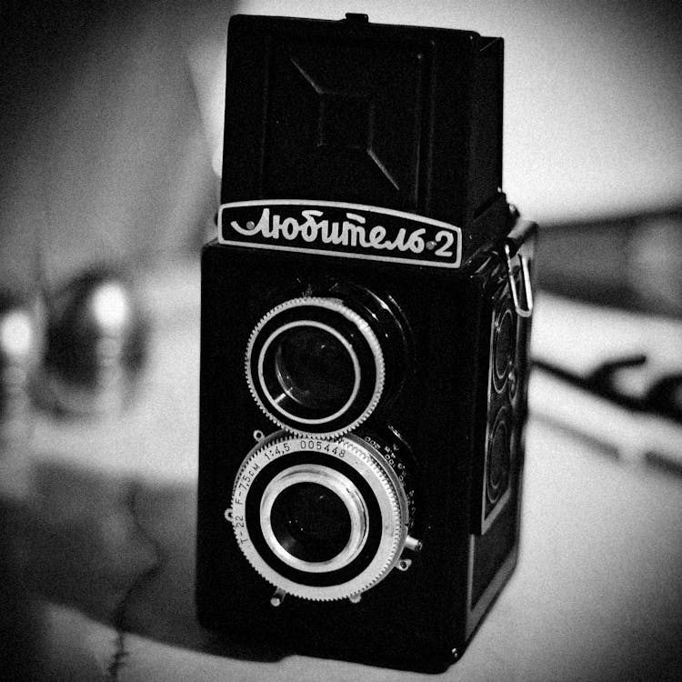 Black And White Photo Of A Vintage Camera